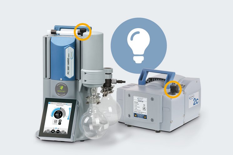 Vacuum pump models PC 3001 VARIO select and MZ 2C NT on a grey background. The integrated gas ballast is highlighted with a yellow circle for better visualization.