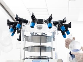 Scientist preparing the freeze dryer for lyophilization